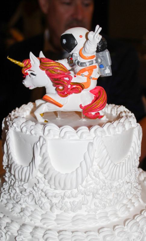 Hand-painted custom unicorn and astronaut cake topper
